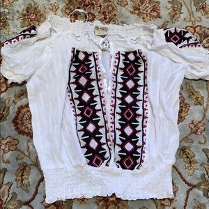 White top with black and pink embroidery